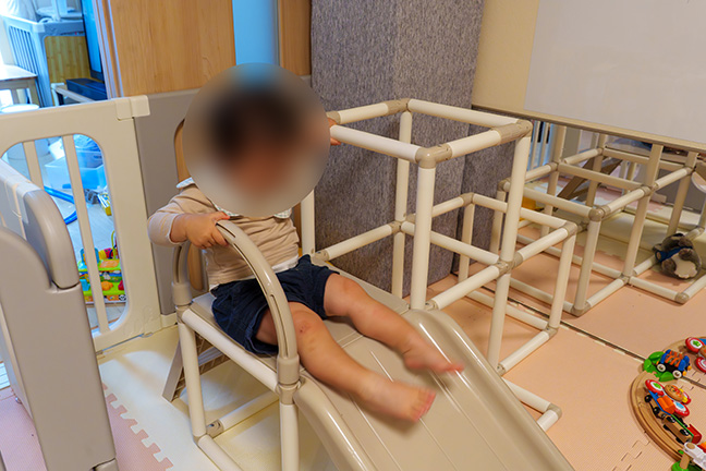 toddler playing indoor gym